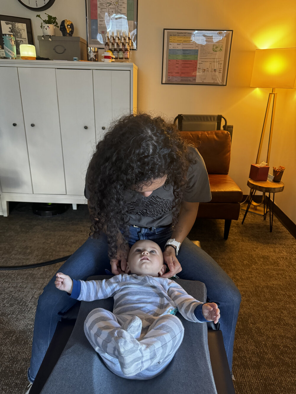 Infant chiropractic adjustment at WholeCare Wellness Collective Marietta
