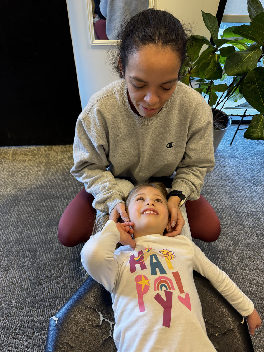 Pediatric chiropractic adjustment at WholeCare Wellness Collective Marietta