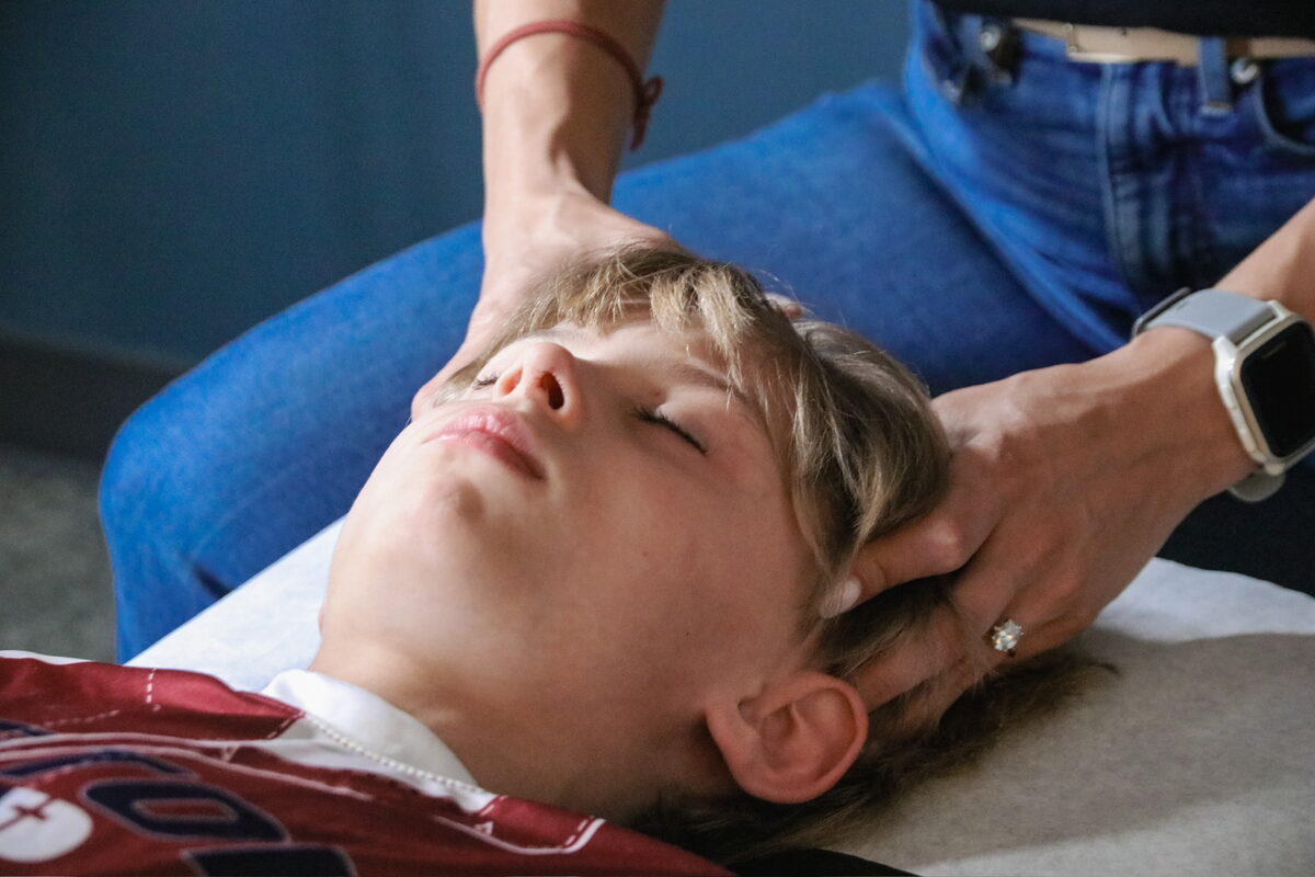 Pediatric chiropractic adjustment at WholeCare Wellness Collective Marietta